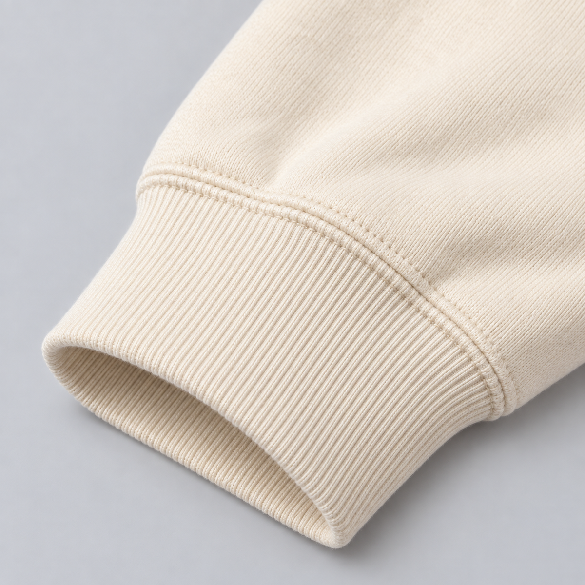 Close-up of ribbed cuff on Ten Toes Down Cream Standard Quarter Zip