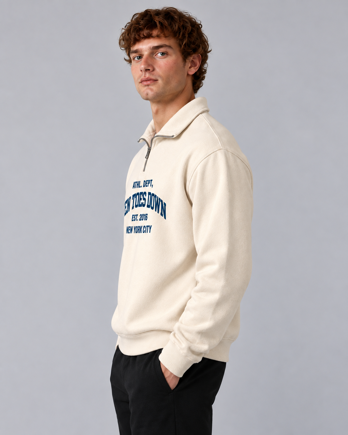Male model wearing Ten Toes Down Cream Standard Quarter Zip, side view